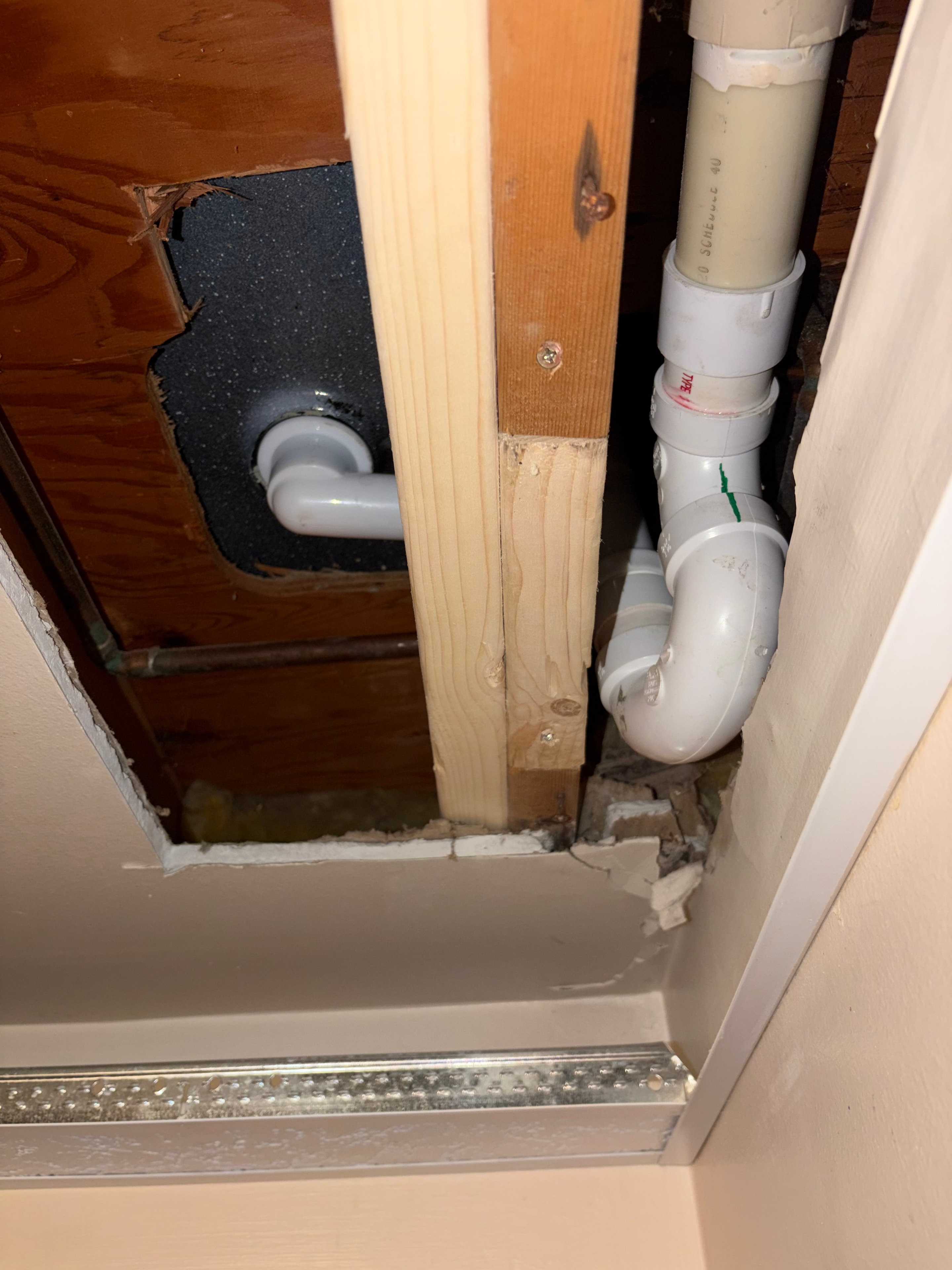 PVC drain rough-in through wall cavity — Buffalo NY
